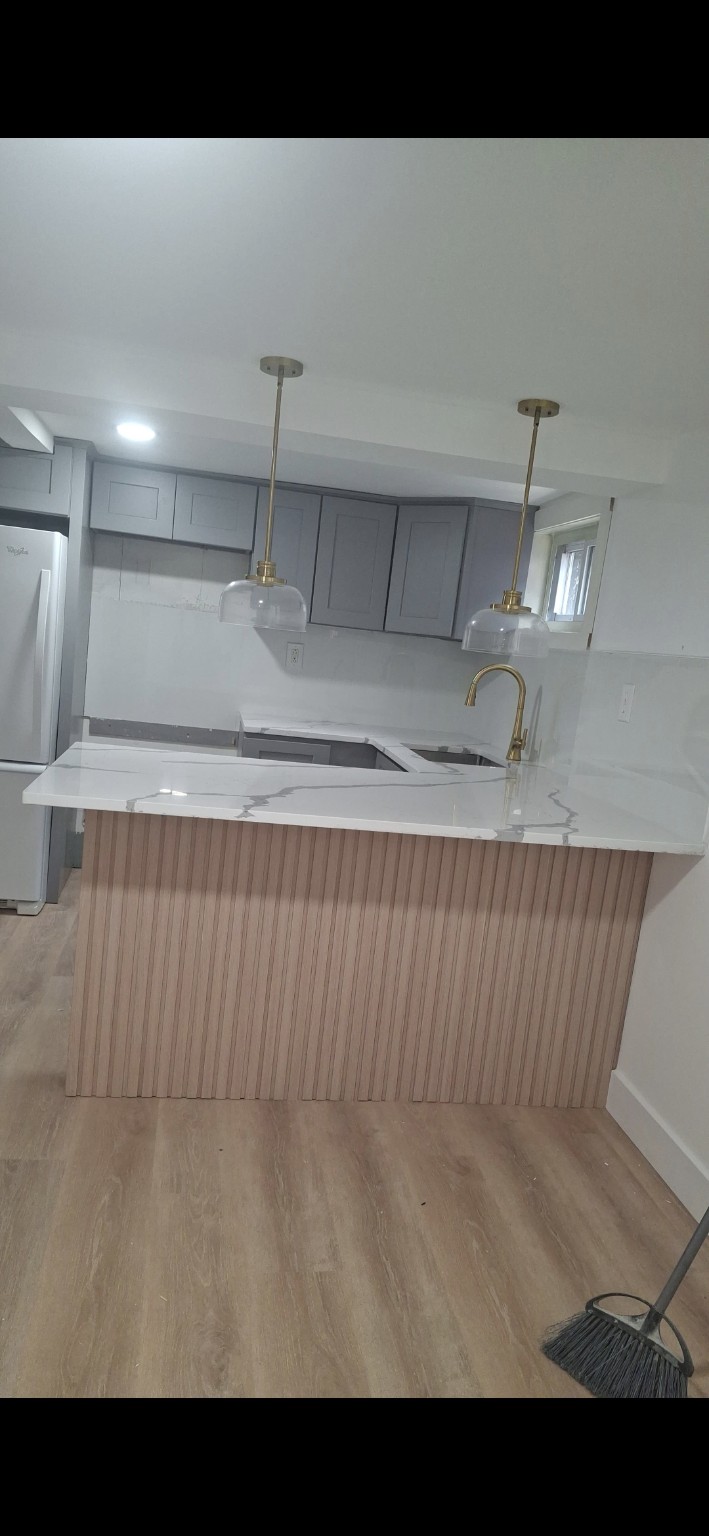 Renovated kitchen by Construction and Details LLC